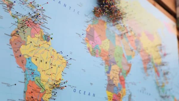 a map of the world with pins on it
