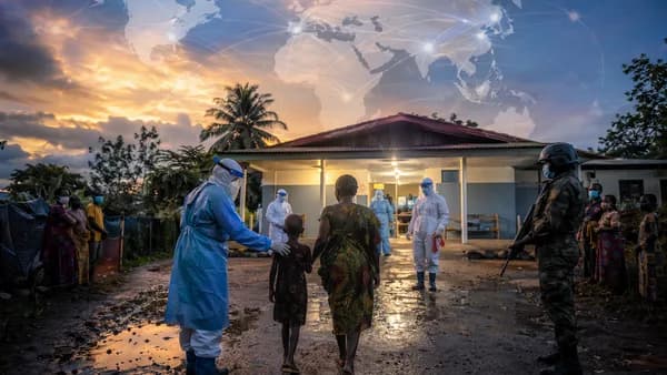 Healthcare workers guide a child back to a DR Congo clinic amid Ebola response tensions.