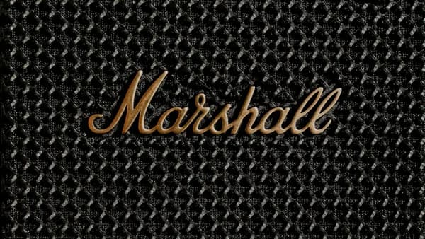 a close up of a metal surface with the word marshall on it
