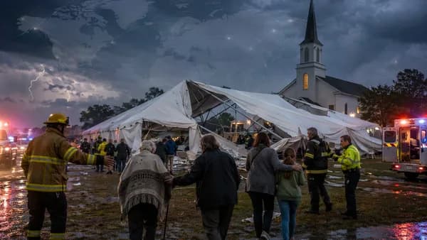 Storm-damaged church celebration tent with responders aiding evacuees in rural Virginia.