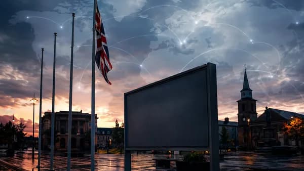 Empty flagpoles outside a British council building with global map overlay, symbolizing a stalled flag scheme.