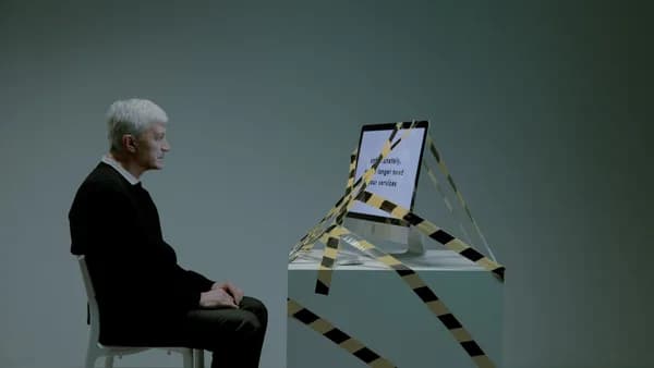 An elderly man sits contemplating job loss, surrounded by caution tape, symbolizing unemployment and ageism.