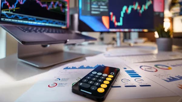 Modern workspace showcasing financial analysis with digital charts and reports.