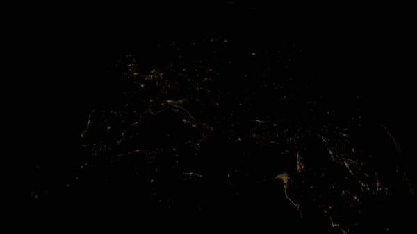 Stunning view of Earth's city lights at night from space, highlighting urban areas.