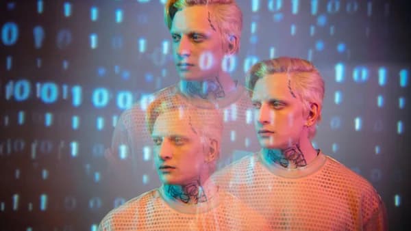 Creative portrait of a man with binary code overlay, blending fashion and digital art.