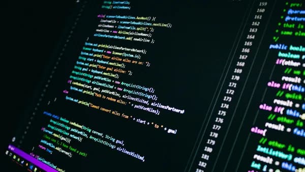 Close-up of colorful programming code on a computer screen, showcasing digital technology.