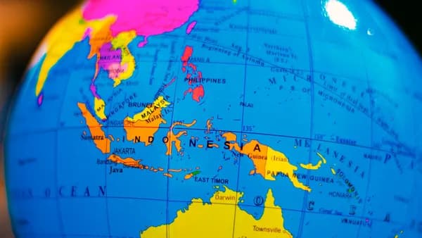 A vibrant globe highlighting Indonesia and surrounding countries in Southeast Asia and Australia.