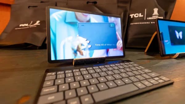 High-quality image of a tablet with a wireless keyboard in a tech showcase setting.