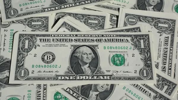 A detailed shot of a pile of U.S. one-dollar bills showcasing currency and finance concepts.