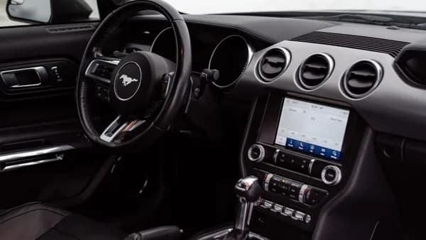 Explore the luxurious interior of a Ford Mustang, showcasing advanced features and sleek design.