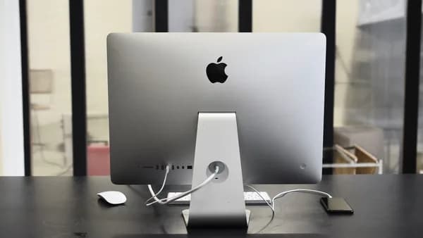 Contemporary convenient computer on table with mobile phone in office of business center