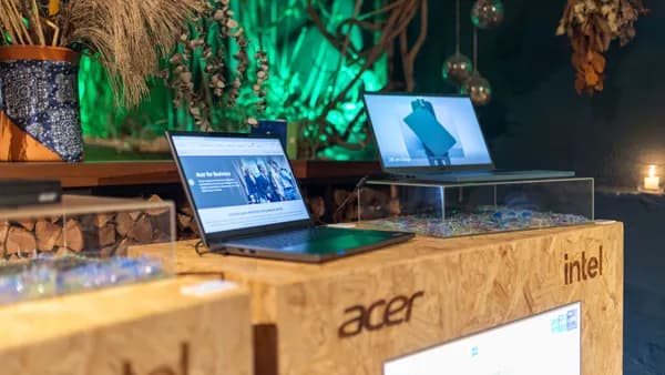 Showcasing Acer laptops with Intel processors at a contemporary tech event.