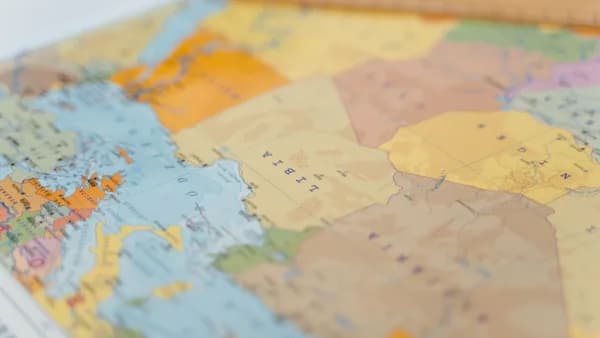 Colorful world map close-up showing African countries with focus on Libya and surrounding areas.