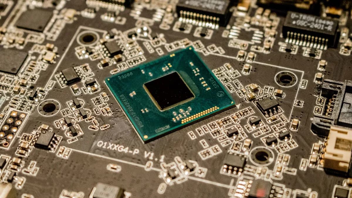 Detailed view of a microchip on a printed circuit board, showcasing electronic components.