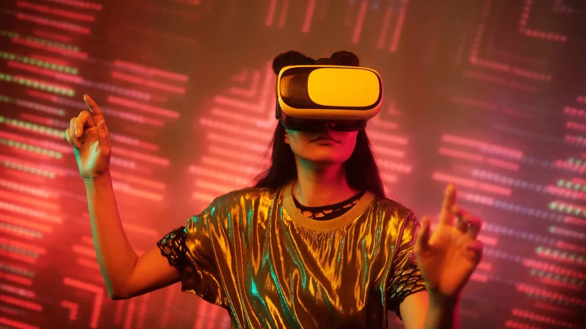 Woman in a metallic top using a virtual reality headset immersed in a digital environment with vibrant lights.