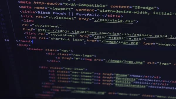 Close-up of HTML and CSS code displayed on a computer screen, ideal for tech and programming themes.