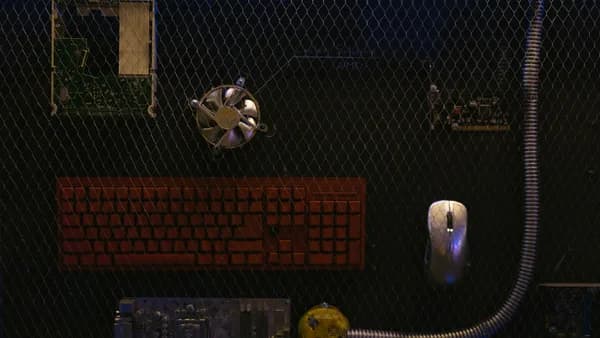 Top view of computer hardware components displayed against a wire mesh background.