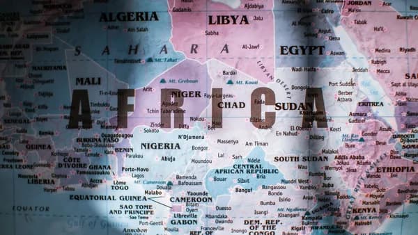Closeup of map of Africa with countries borders and water on sunny day