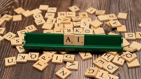 Wooden letter tiles spelling AI, representing technology and innovation.