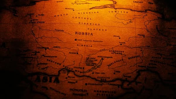Close-up of a sepia toned vintage map highlighting Russia and Siberia.