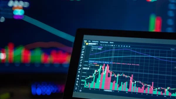 Colorful trading charts showing cryptocurrency market trends on a computer screen.
