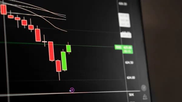 Candlestick chart showing a downward trend in the stock market analysis.