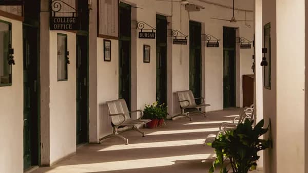 Serene corridor of La Martiniere College in Lucknow, India, showcasing vintage architecture.