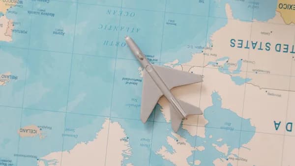 A toy airplane resting on a map, symbolizing travel and adventure planning.