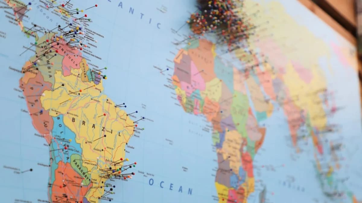 a map of the world with pins on it