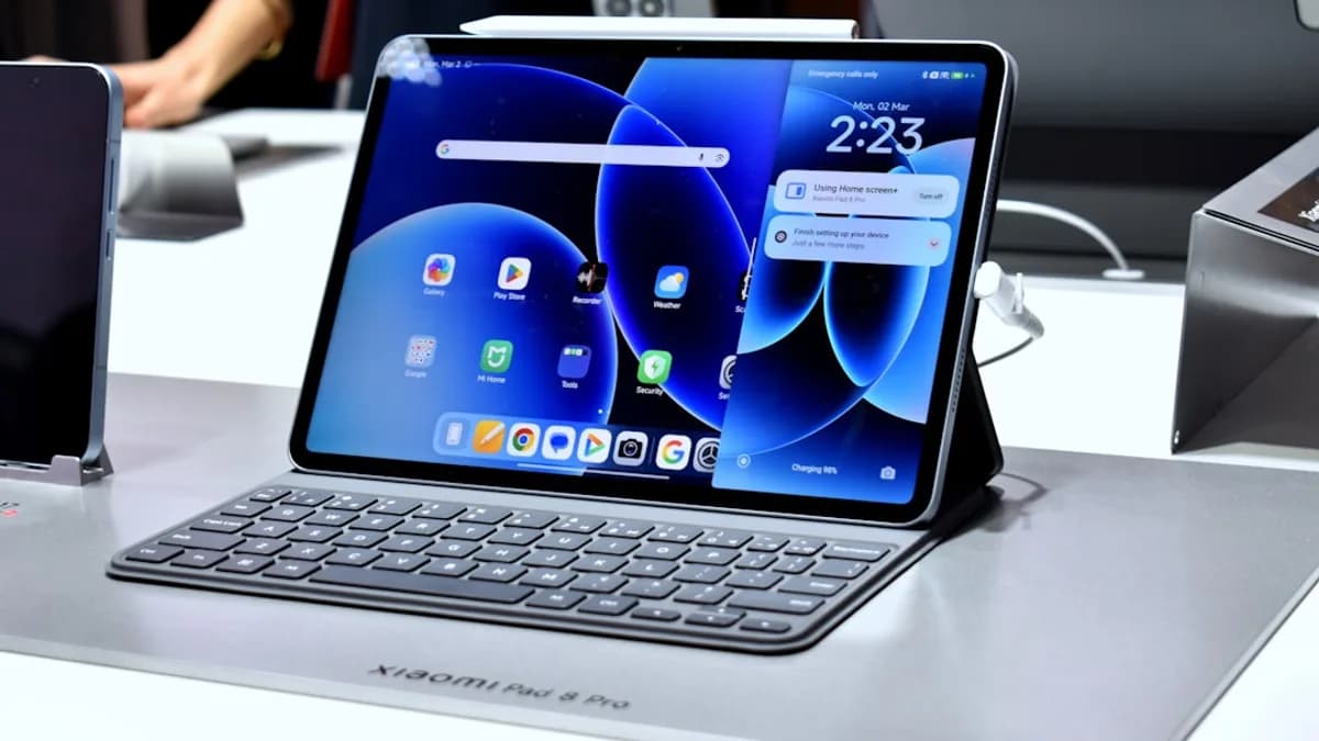 A tablet with a keyboard and colorful wallpaper.