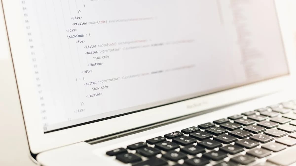 turned on MacBook Air displaying coding application
