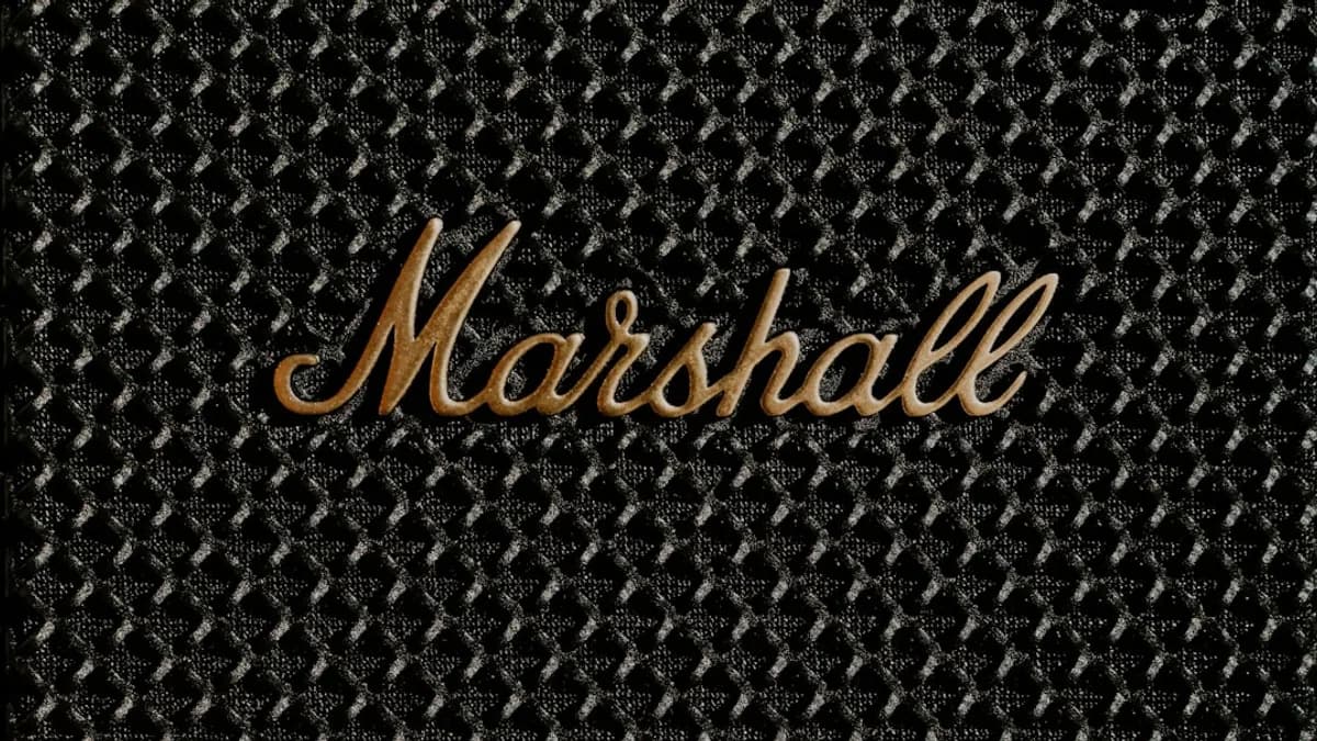 a close up of a metal surface with the word marshall on it