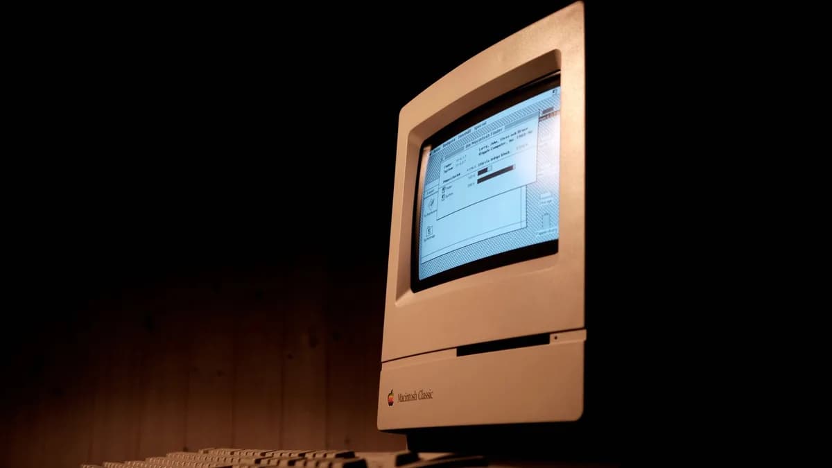 Close-up of a Macintosh Classic computer, showcasing vintage technology and nostalgia.