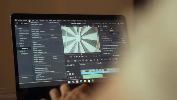 Laptop displaying video editing software interface for cinematic storytelling.