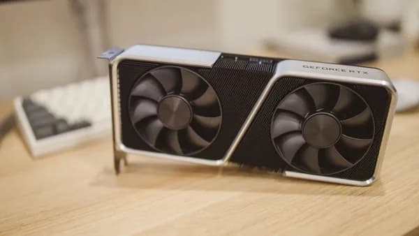 Close-up of a GeForce RTX graphics card on a desk, showcasing its design and technology.