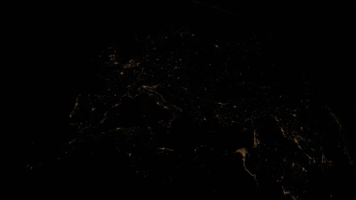 Stunning view of Earth's city lights at night from space, highlighting urban areas.