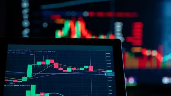 Close-up view of digital trading chart screen with vibrant graphs and data analysis.