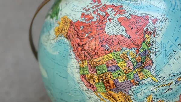 Detailed globe of North America highlighting countries and regions.