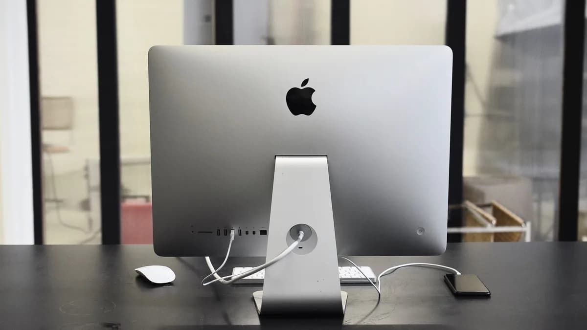 Contemporary convenient computer on table with mobile phone in office of business center