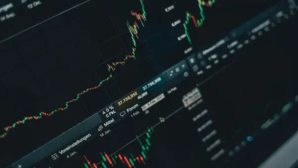 Close-up of stock market trading screen displaying financial growth and charts.
