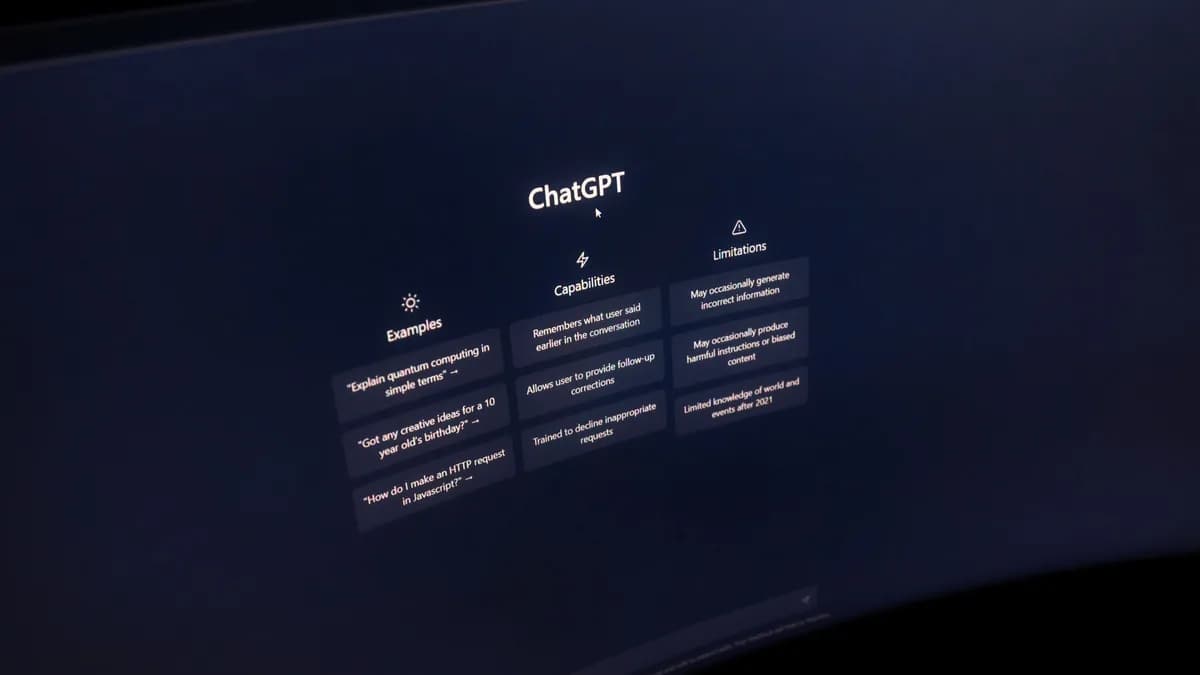 Close-up of a computer screen displaying ChatGPT interface in a dark setting.