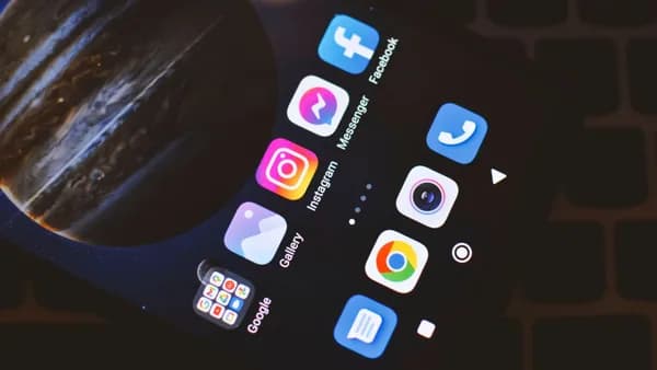 Smartphone screen showing popular social media and app icons including Facebook and Instagram.