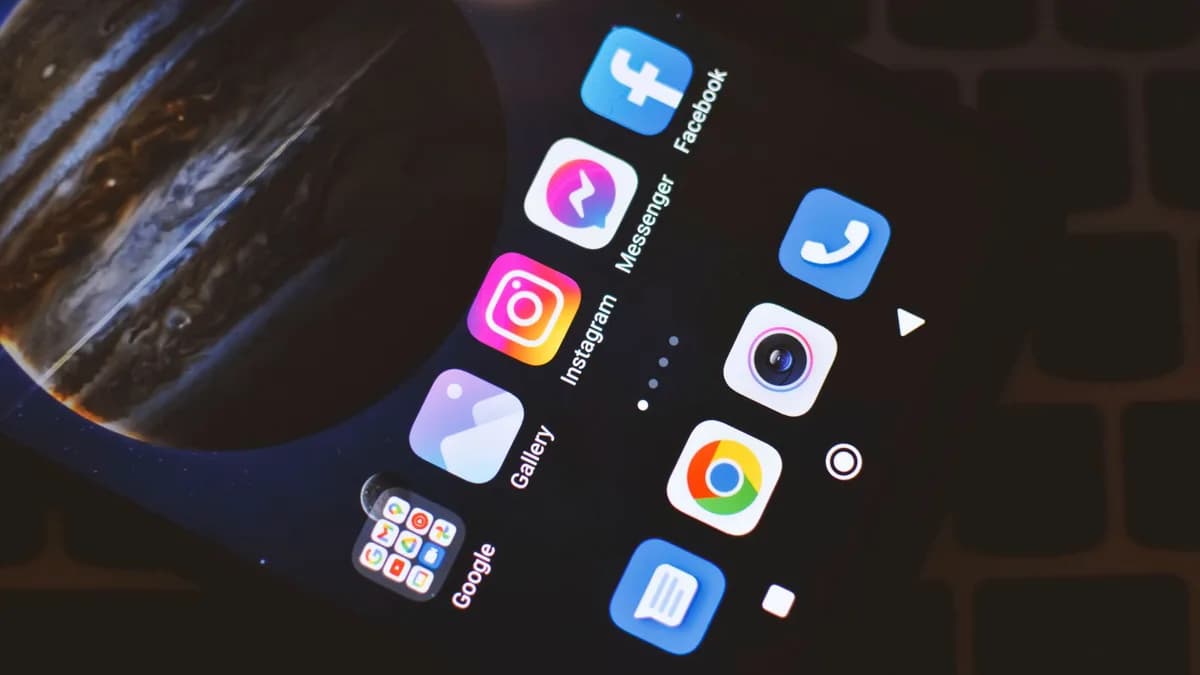 Smartphone screen showing popular social media and app icons including Facebook and Instagram.