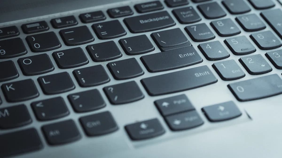 Detailed view of a laptop keyboard with focus on keys. Ideal for tech content.