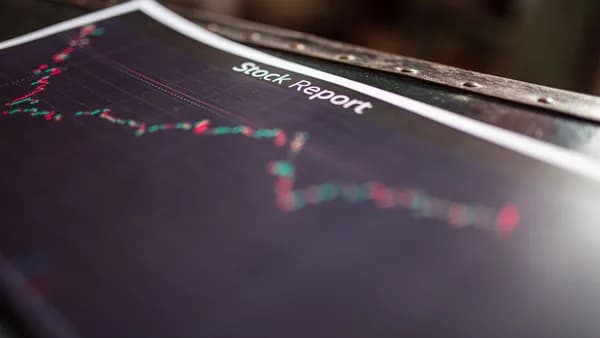 Detailed stock report showing market trends on paper charts.
