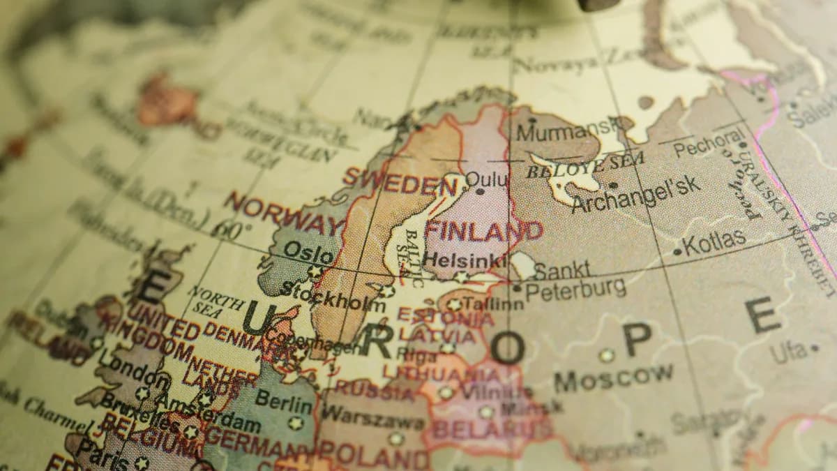Detailed close-up image of a globe focusing on Northern Europe, featuring country labels and borders.