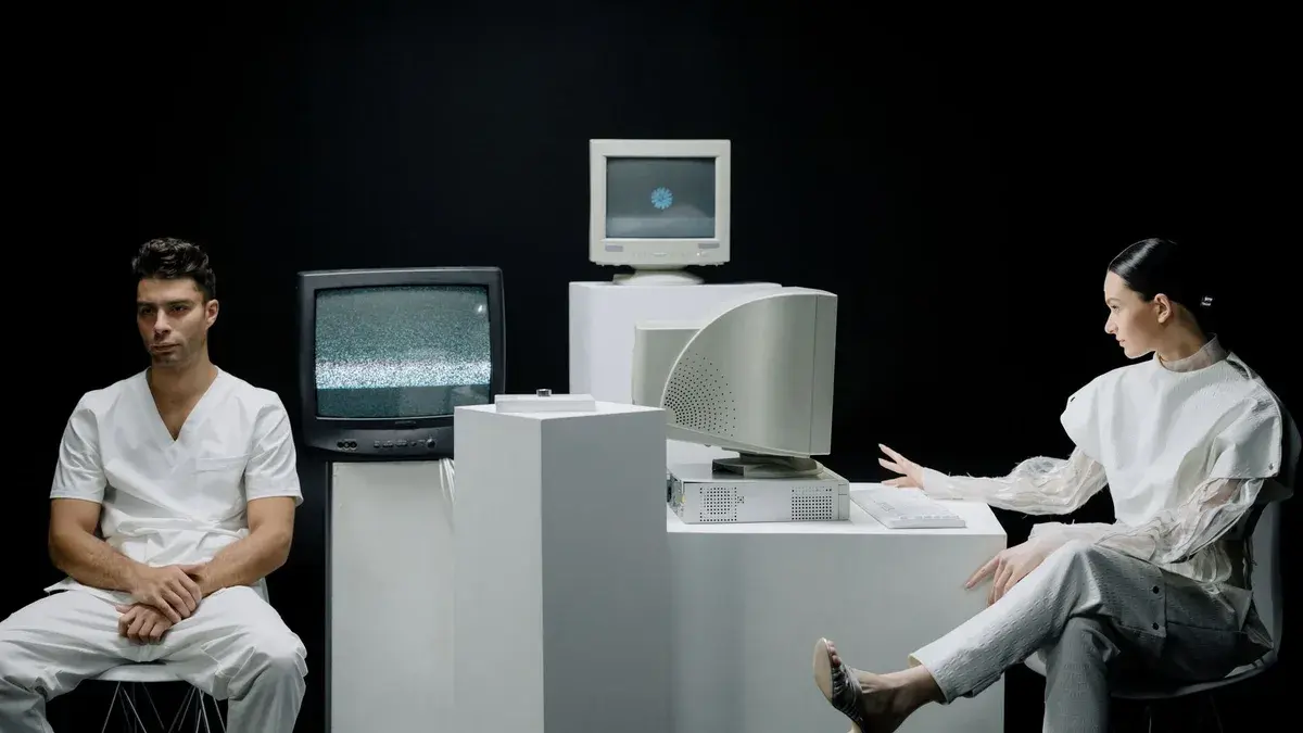 A modern depiction with vintage computers and individuals in a futuristic lab setting.
