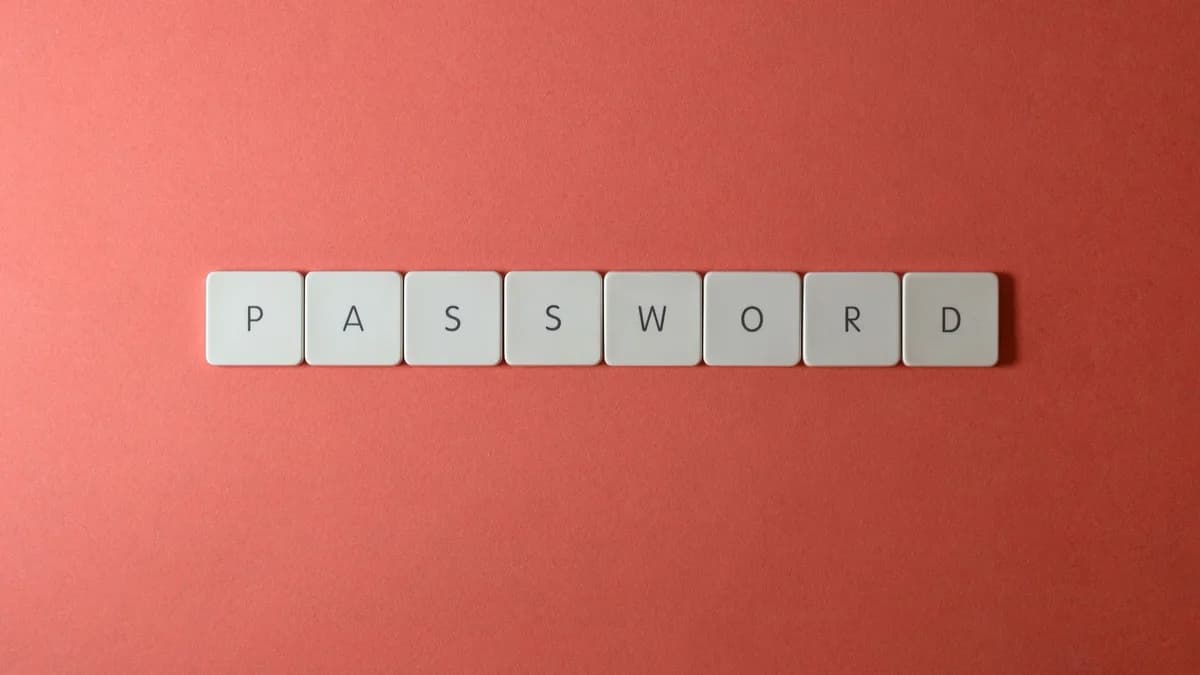 Focus on password security with white keyboard tiles spelling 'PASSWORD' on a coral background.