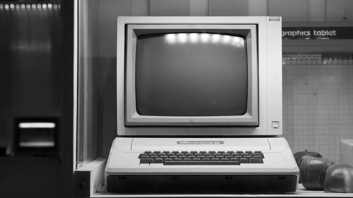Black and white image of a classic Apple II computer on display in Wrocław, Poland.