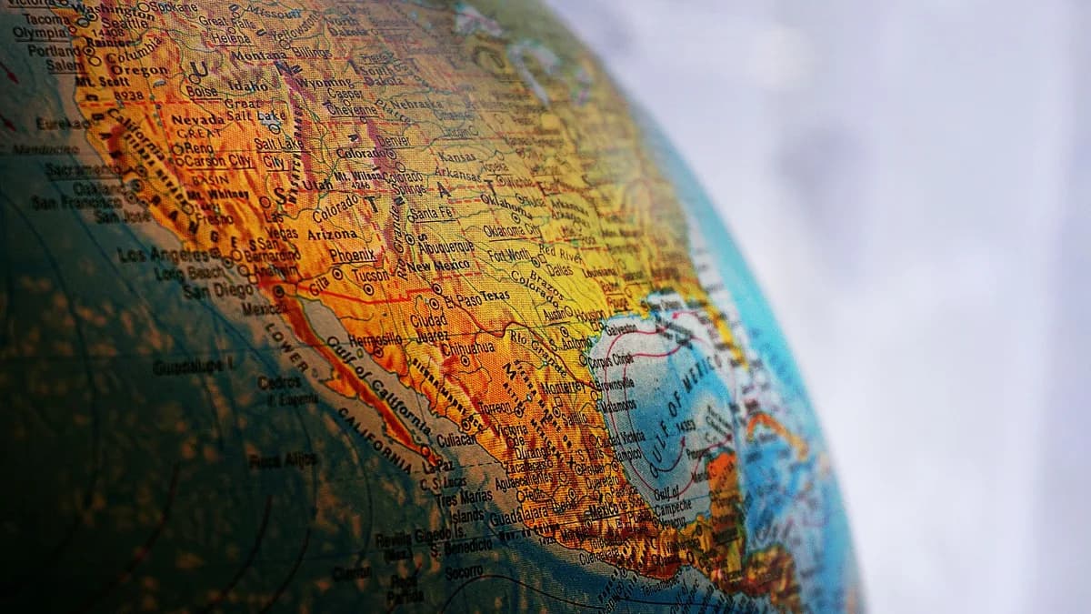 Close-up of a globe highlighting North America, showcasing geography and cartography details.